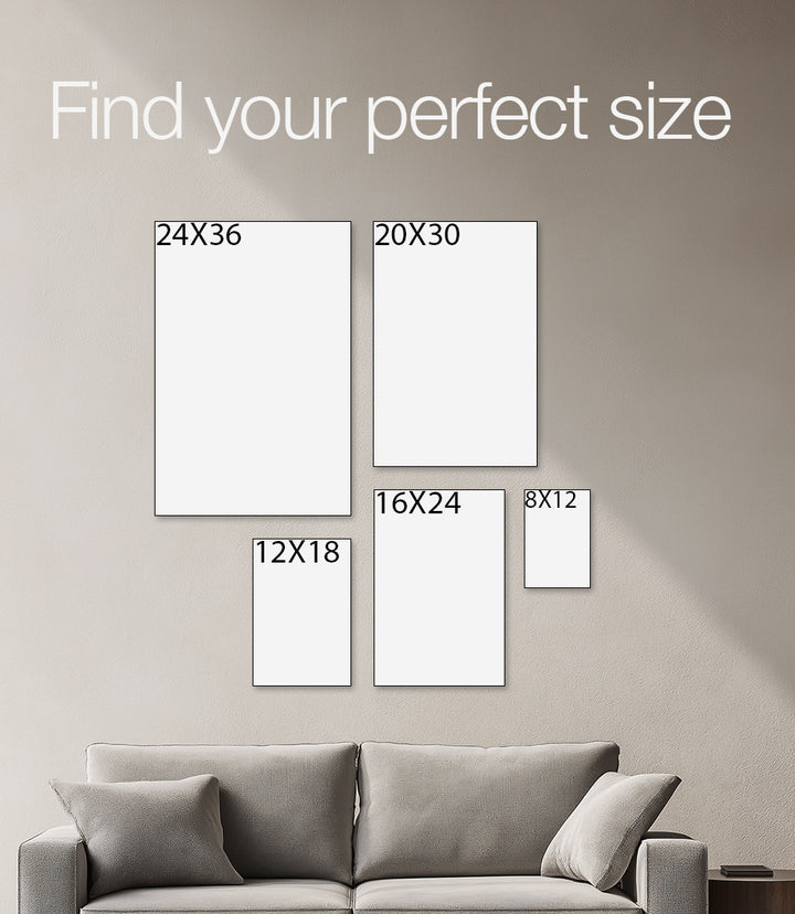 Wall with framed artworks of different sizes and a gray sofa.
